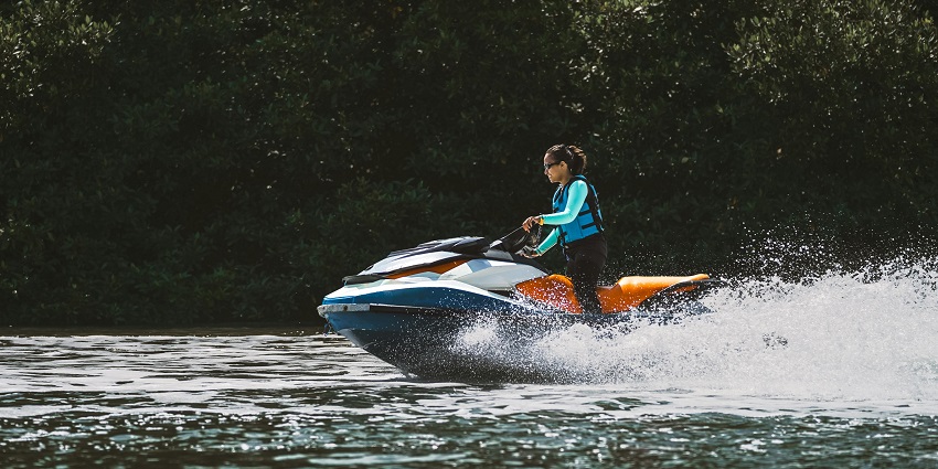 An image of a person riding a jet ski, one of the best Mandwa Beach water sports.