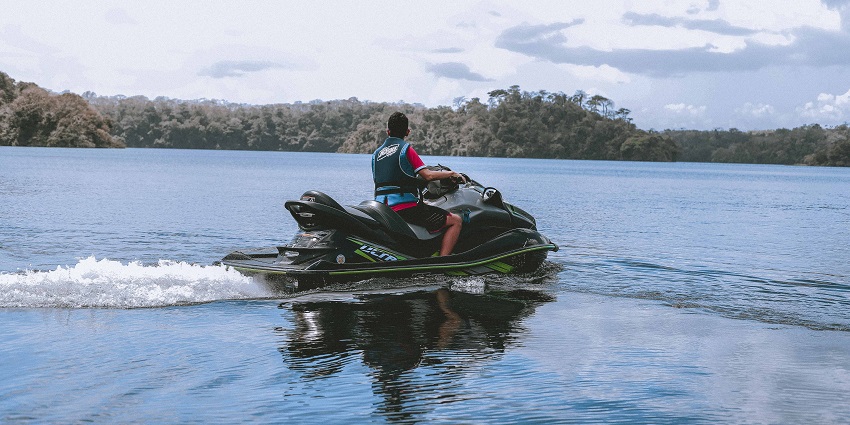 Image of a man jet skiing - A water sport enthusiast enjoying jet skiing at Aamby Valley Lake
