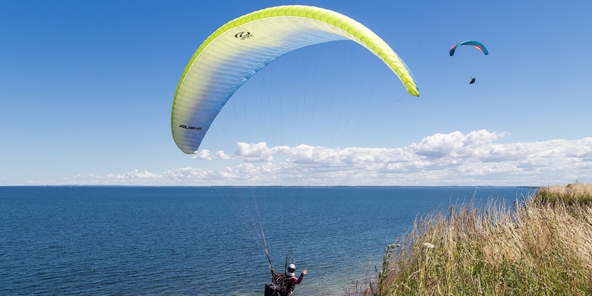 Capture the beauty of Daman from above while paragliding.