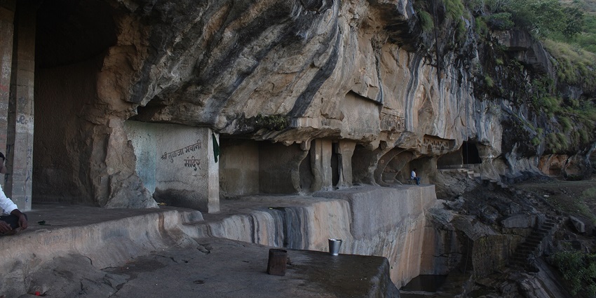 Ancient Buddhist caves carved into a cliff face is a tourist attraction near Lenyadri Caves.