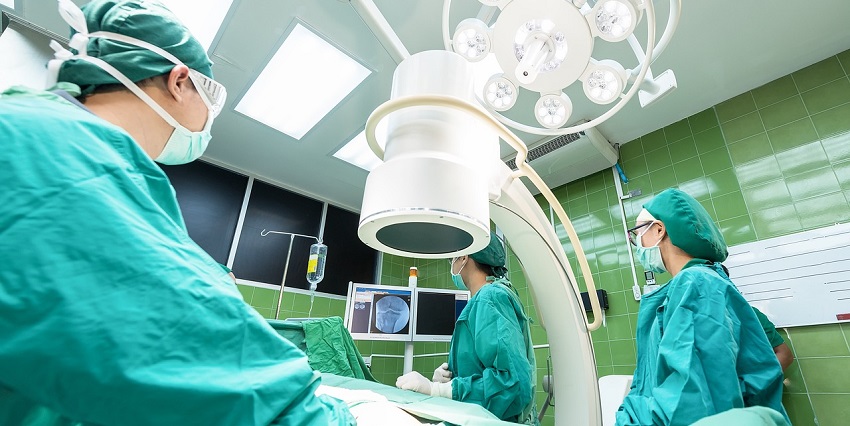 A representative picture of an operation room in a hospital where doctors are doing a surgery.