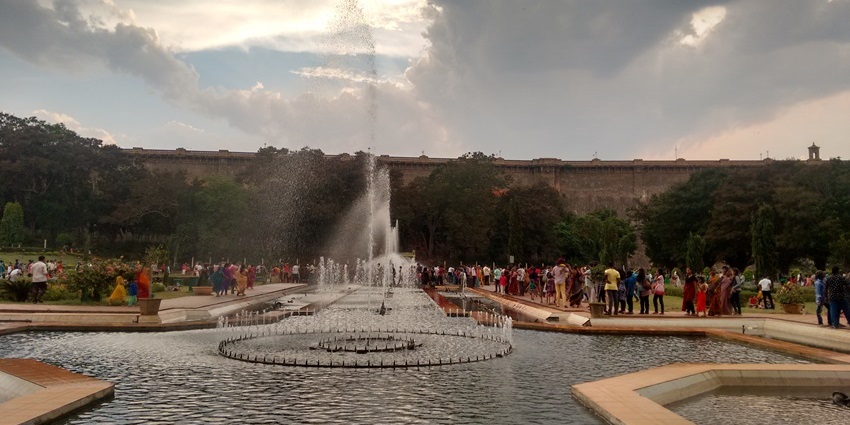 A grand irrigation dam with scenic views, illuminated gardens, and a musical fountain show.