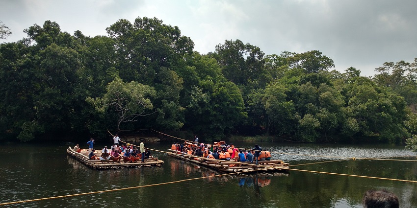 View of the serene Kabini river with two boats in it, one of the best places to visit near Bangalore in monsoon