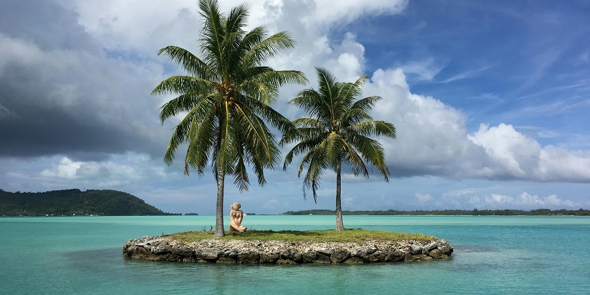 A glimpse of the picturesque Kadmat Island surrounded by shimmering blue waters.