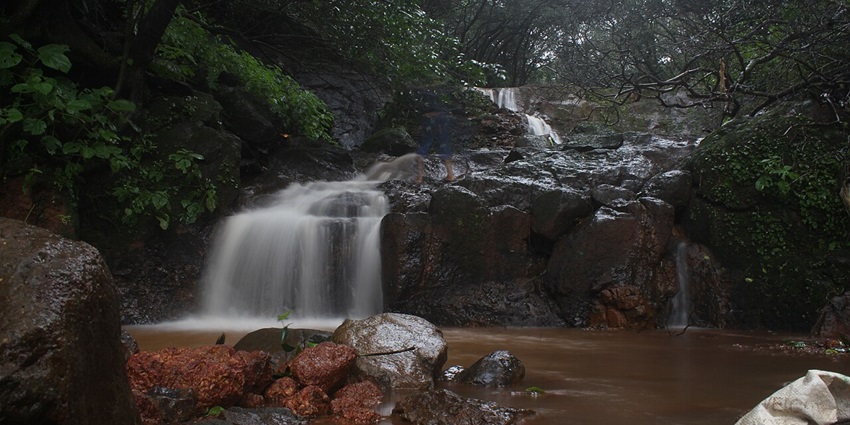 Kal Mandavi Waterfall feature stunning cascades surrounded by lush greenery.