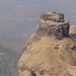 Kalavantin's Mahal, a historic tourist attraction near Maharashtra, has stone arches.