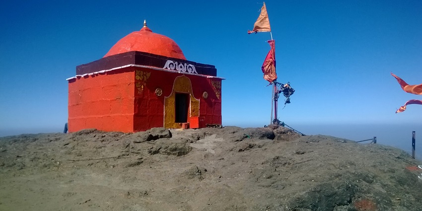 A flattering view of a temple atop Mt. Kalsubai, a best places to visit near nashik in monsoon