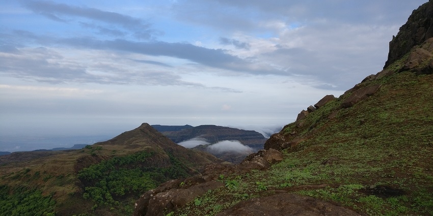 Scenic view from Kalsubai Peak with the blue sky canvas