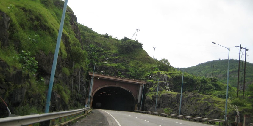 Kamshet Tunnel on the Mumbai-Pune Expressway is surrounded by lush green hills.