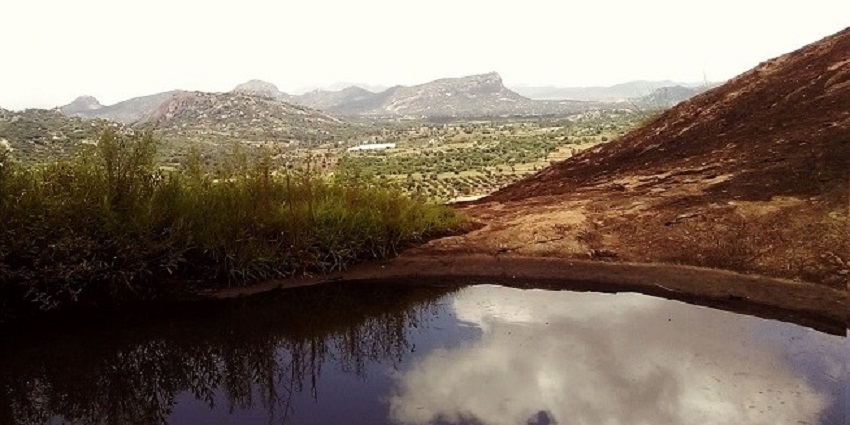 A breathtaking view from the top of Kanakapura Hill, showcasing lush green landscapes.
