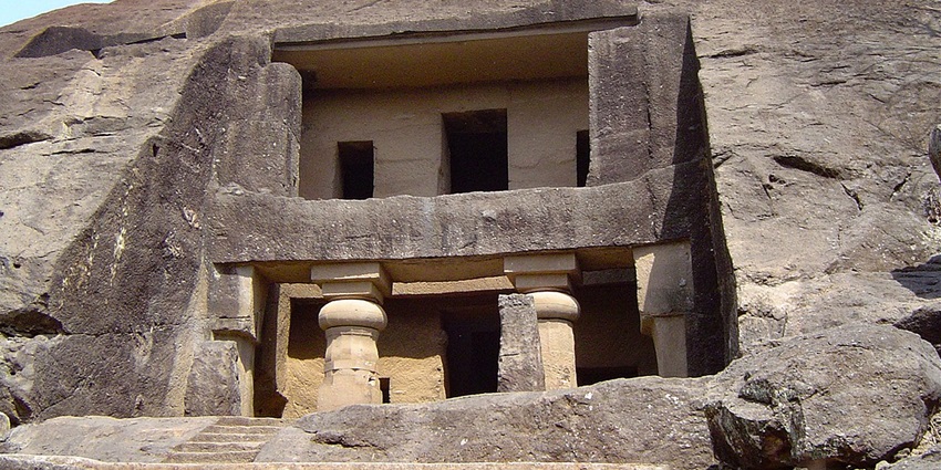 A view of the rustic Kanheri Caves exuding historical significance and old-world charm.