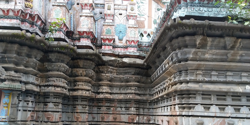 Ancient temple surrounded by lush greenery and serene atmosphere.