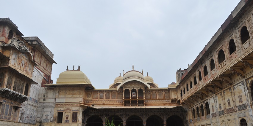 A stunning view of the Karauli City Palace showcasing its inner royal architecture.