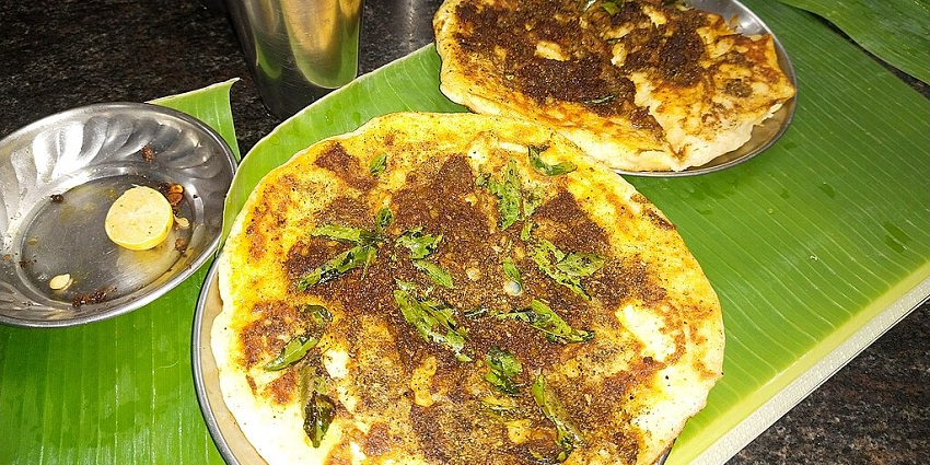 The famous food in Coimbatore is the thick dosa topped with spiced mutton.