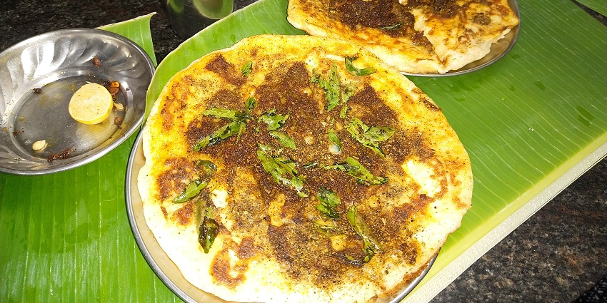 The famous street food in Madurai - Kari Dosa, a spicy meat dosa with chutney.