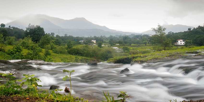 A panoramic picture capturing the lush green hills of Karjat, a summer retreat near Mumbai