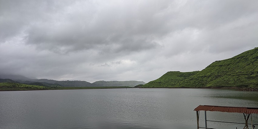 A boat docked in the lake on Pali Bhutivali Reservoir near Karjat, Maharashtra.