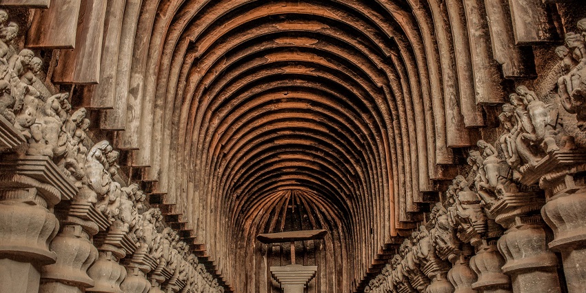 Karla Caves are ancient rock-cut Buddhist caves with intricate carvings and details.