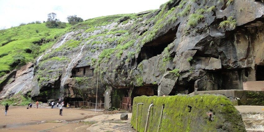 Karla Caves in Lonavala, surrounded by lush greenery and moss