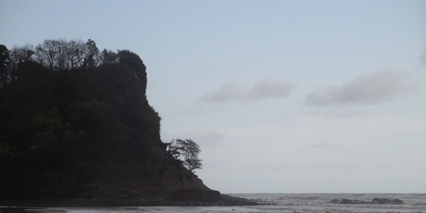 View of the beach at magic blue hour with clear waters and waves