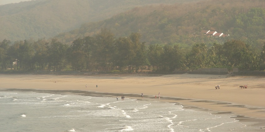 Stunning view of Kashid Beach, where golden sands meet the sparkling blue sea.