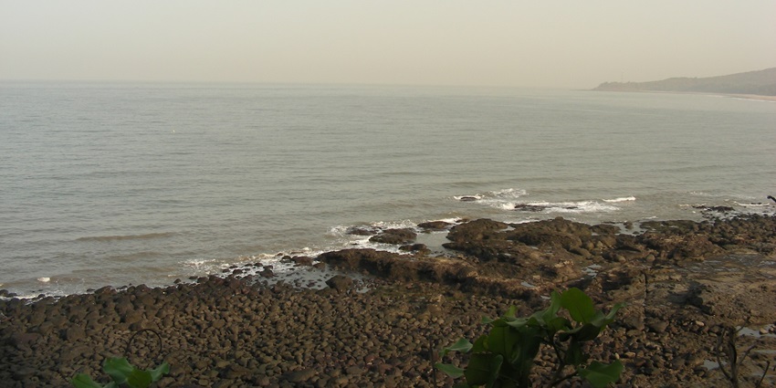 Scenic view of Kashid Beach in India with golden sands and gentle waves in the background