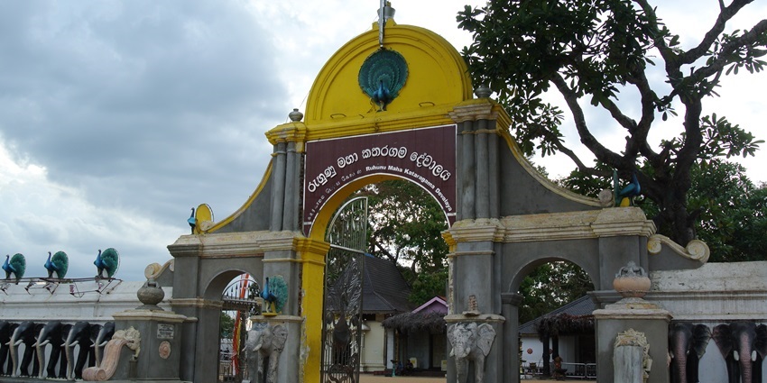 A picture of the entrance of a traditional Hindu temple in Sri Lanka with intricate art on its walls