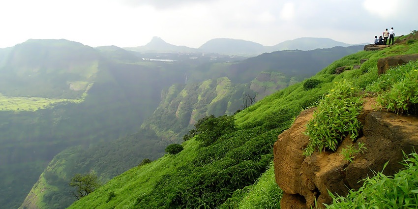 A picture of Katraj trail with greenery and distant hills, one of the best trails for hiking in Pune