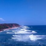 Kayaking in Varkala is a surreal experience due to its scenic backwaters and calm waves.