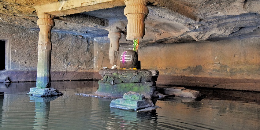 The sacred Shivling inside Kedareshwar Cave Temple, a famous spot in Maharashtra.