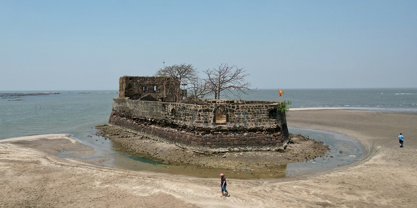 A glimpse of an iconic fort at the Kelva Beach, a serene attraction in Maharashtra.