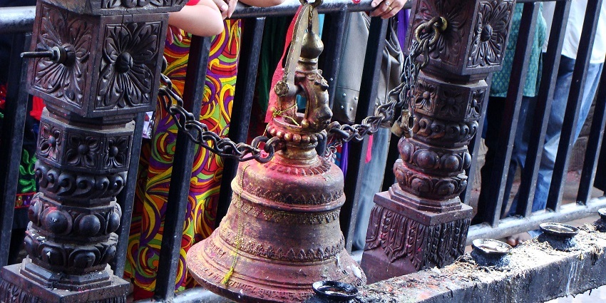 A glimpse of a temple with intricate carvings and tranquil ambiance for reflection.