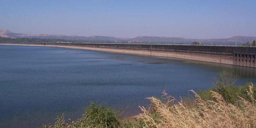 View of Khadakwasla Dam near Krushnai Water Park, surrounded by water and greenery hills