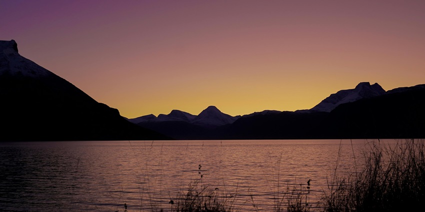 Image of a lake view in the evening with colourful sky reflection on the lake water