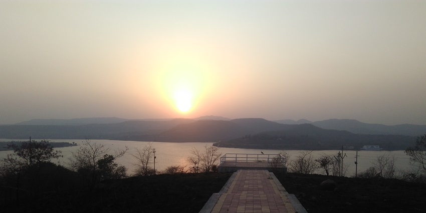 A serene lakeside spot offering breathtaking sunset views and picnic areas, one of the best places to visit in winter in Pune.