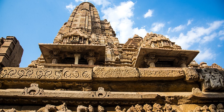 View of intricately carved Khajuraho temple showcasing stunning sculptures and architecture