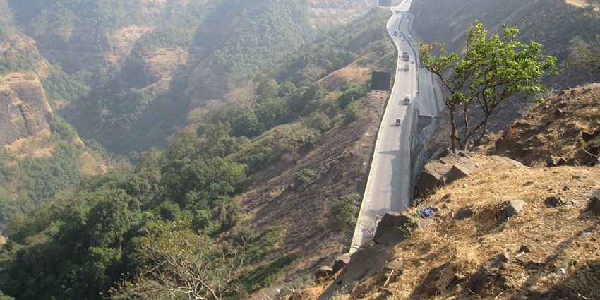 Scenic view of Khandala's lush green hills and valleys with a misty atmosphere in India.