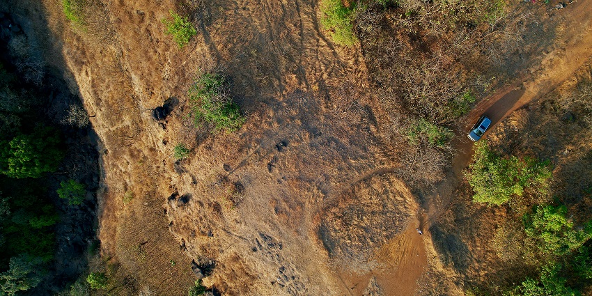 An aerial view of rustic terrains, rolling hills, lush greenery of the scenic Khandala.