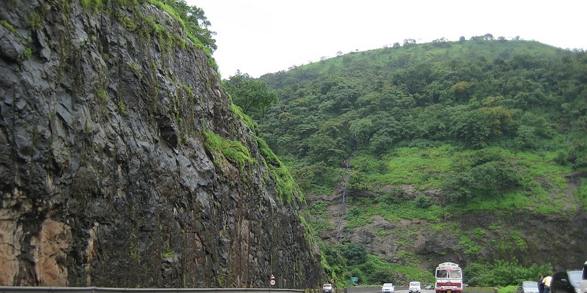 Breathtaking view of Khandala hills featuring a tourist attraction near Samangad Fort