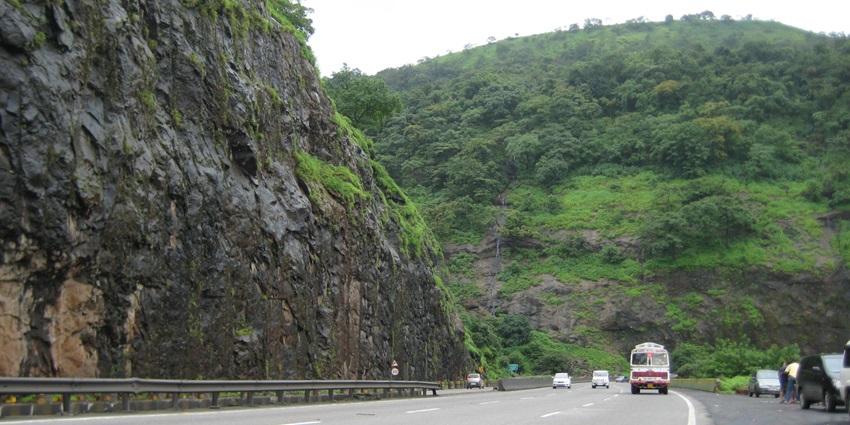 Scenic view of Khandala Ghat along the Mumbai-Pune Expressway with green hills.