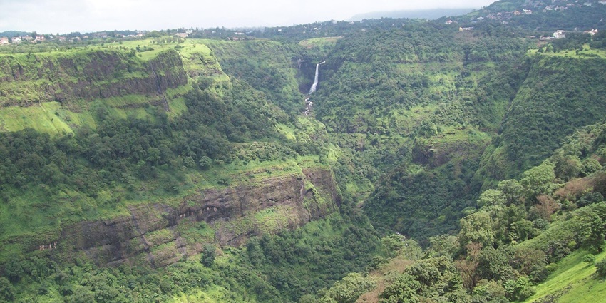 Serene view of Waterfall amidst dense forest, a stunning example of waterfalls in Maharashtra.