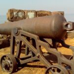 British cannon positioned at Khanderi Fort, showcasing historical military heritage.