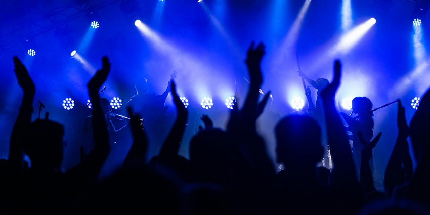 A glimpse of people dancing to the acoustical beats with neon lights in Maharashtra.