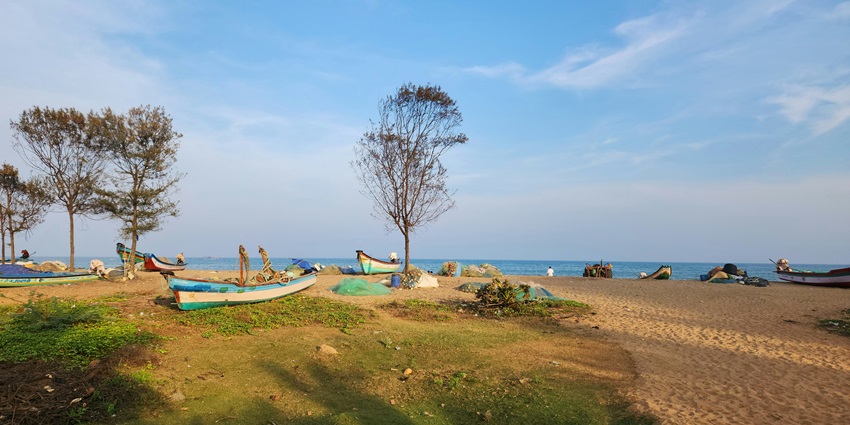 Panoramic view of the beautiful sandy shores of Kodikkarai beach full of boats