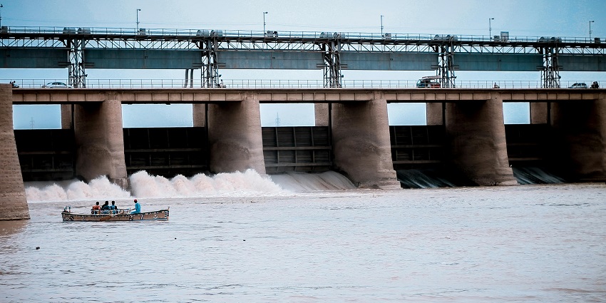 A glimpse of a picturesque dam with waterfalls, perfect for picnics and relaxation.