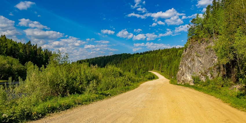 Image of twisty road around the Kolli Hills with picturesque view under clear blue sky