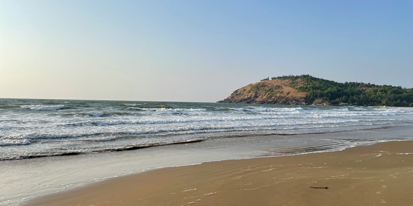 Clean and serene Kolthare Beach with gentle waves, one of the top places to visit in Dapoli.