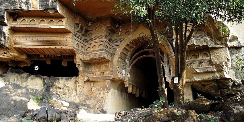 The Kondana Caves in Maharashtra feature ancient rock-cut architecture surrounded by lush greenery