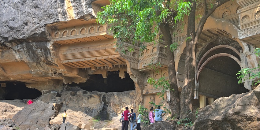 The picture of the Kondana caves in Maharashtra where tourists are exploring the site.