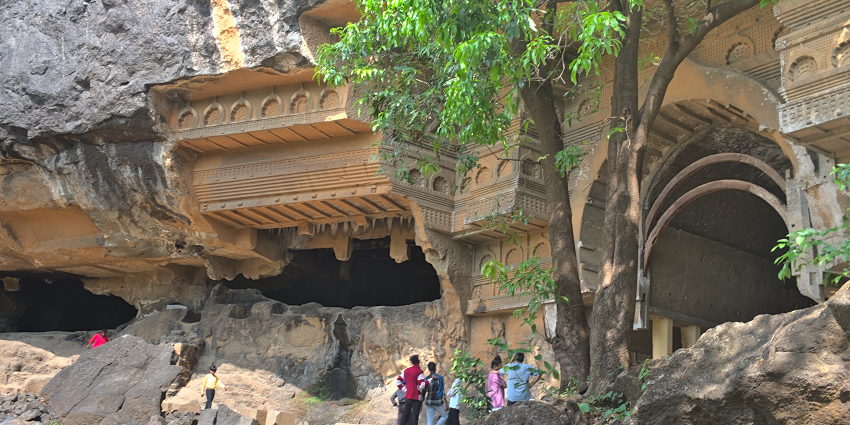 Intricate rock-cut architecture of Kondana Caves, showcasing ancient artistry and history.